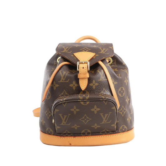 Louis Vuitton Monogram Canvas Montsouris Vintage Mini Backpack M51137 with brown Monogram canvas, natural leather trim, front zip pocket, buckle flap, and drawstring closure, displayed upright against a white background.