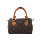 Louis Vuitton Speedy Nano handbag in brown Monogram canvas with natural leather top handles, gold-tone hardware and zip-top closure, displayed against a white background.