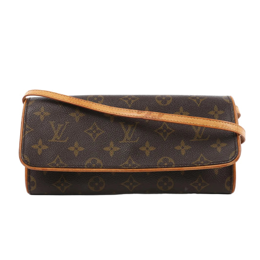 Louis Vuitton Monogram Canvas Pochette Twin GM Shoulder Bag M51852 featuring a slim rectangular silhouette, flap closure, natural leather trim, and shoulder strap, displayed flat against a white background.