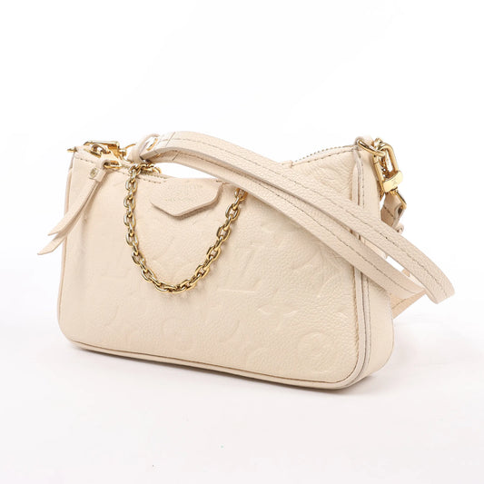 Louis Vuitton Monogram Empreinte Easy Pouch Handbag in Beige M81066