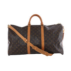 Brown Louis Vuitton Monogram Keepall Bandoulière 55 travel bag with tan leather handles, shoulder strap and gold-tone hardware, shown from multiple angles.