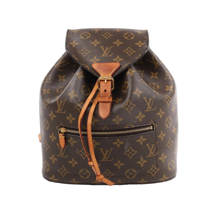 Louis Vuitton Monsley Backpack M43431 in brown monogram canvas with tan leather trim, buckle flap closure, drawstring, front zip pocket, and structured silhouette against a white background.