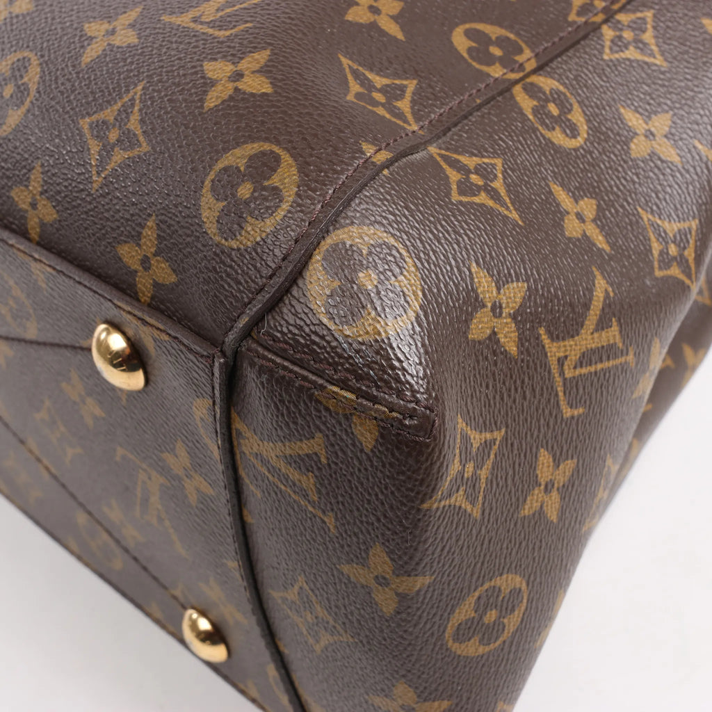 Louis Vuitton Montaigne GM Monogram Canvas Handbag in Brown