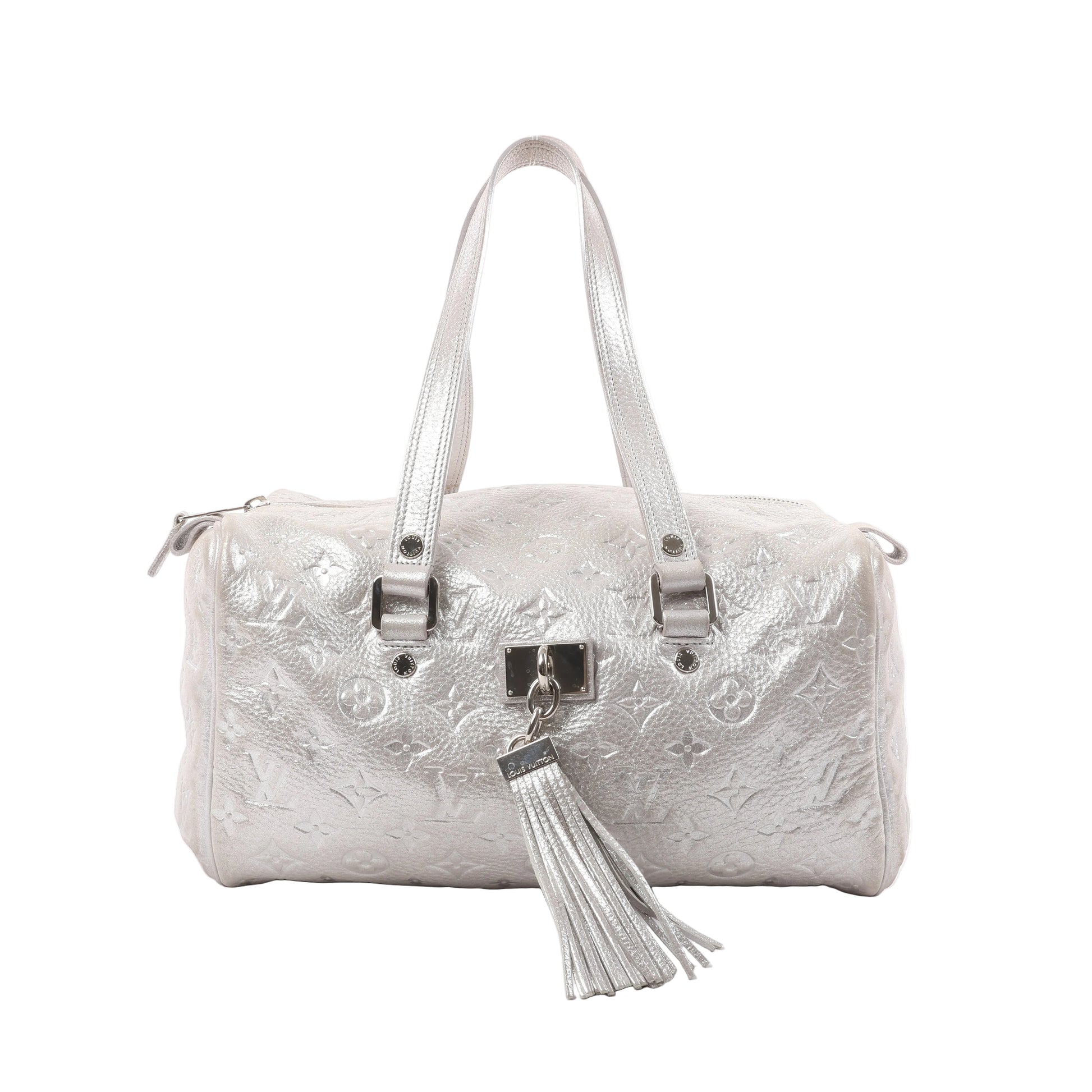 Louis Vuitton Comète Limited Edition shoulder bag in shimmer silver Monogram-embossed leather, featuring dual handles, front tassel accent, and metallic finish.