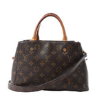 Louis Vuitton Montaigne BB handbag in brown Monogram canvas with tan rolled handles, detachable shoulder strap and gold-tone hardware.