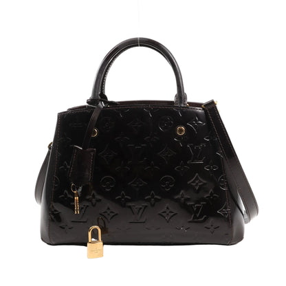 Louis Vuitton Montaigne BB 2Way handbag M50403 in dark purple Monogram Vernis patent leather, featuring dual top handles, detachable shoulder strap, gold-tone hardware, embossed LV pattern, clochette with keys, and a padlock.