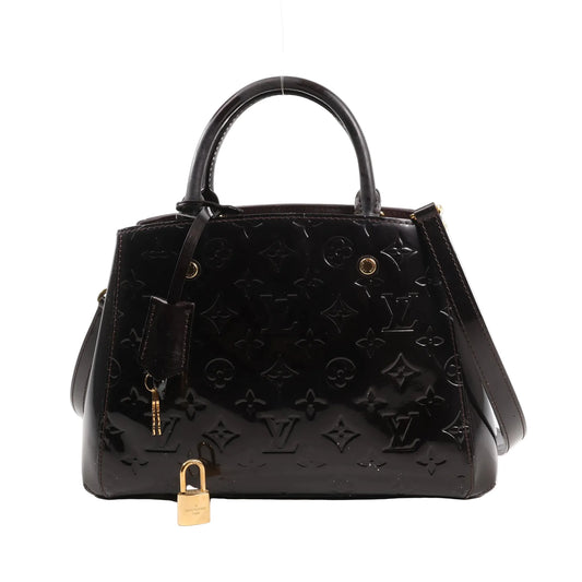 Louis Vuitton Montaigne BB 2Way handbag M50403 in dark purple Monogram Vernis patent leather, featuring dual top handles, detachable shoulder strap, gold-tone hardware, embossed LV pattern, clochette with keys, and a padlock.