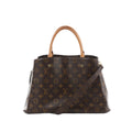Louis Vuitton Montaigne MM brown Monogram canvas handbag with vachetta top handles and detachable shoulder strap on white background.