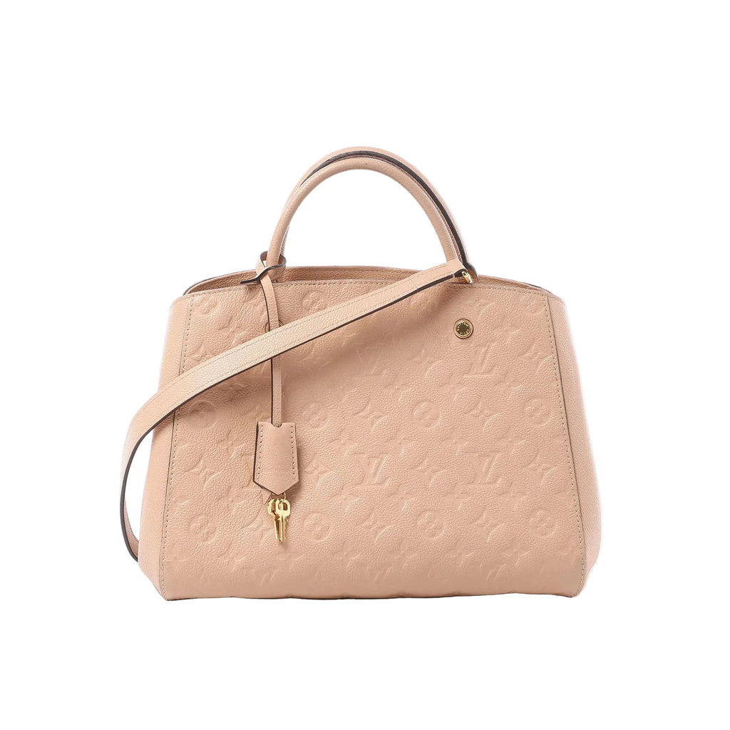 Louis Vuitton Montaigne MM beige Monogram Empreinte leather handbag with top handle, hanging key charm, and detachable shoulder strap on white background