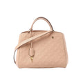 Louis Vuitton Montaigne MM beige Monogram Empreinte leather handbag with top handle, hanging key charm, and detachable shoulder strap on white background