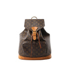 Louis Vuitton Monogram canvas Montsouris GM backpack with tan leather buckle flap, drawstring closure, front zip pocket, and vachetta leather base