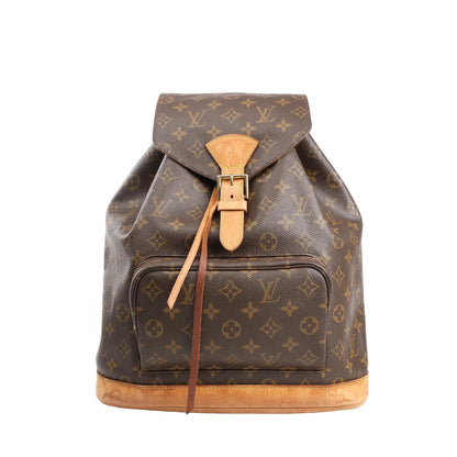 Louis Vuitton Montsouris GM vintage backpack in brown Monogram canvas with natural leather trim, front zip pocket, buckle flap closure, and drawstring, displayed on a white background.