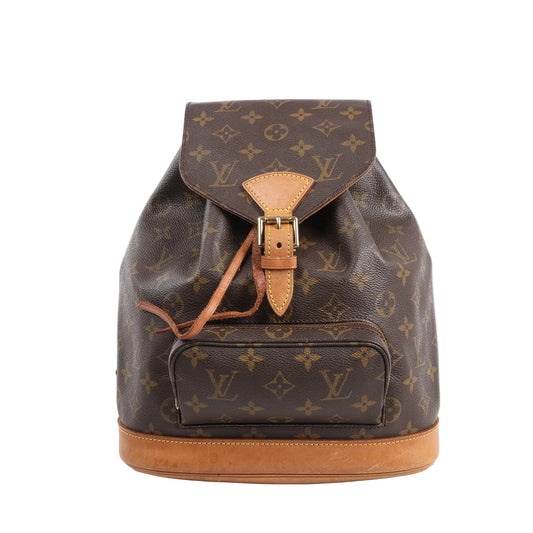 Louis Vuitton Monogram Canvas Montsouris Vintage MM Backpack M51136 in brown monogram coated canvas with natural leather trim, buckle flap closure, front zip pocket, and leather drawstring, displayed upright against a white background.