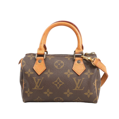 Louis Vuitton Speedy Nano 2Way handbag in brown Monogram canvas with natural vachetta leather handles and trim, gold-tone hardware, and detachable shoulder strap.
