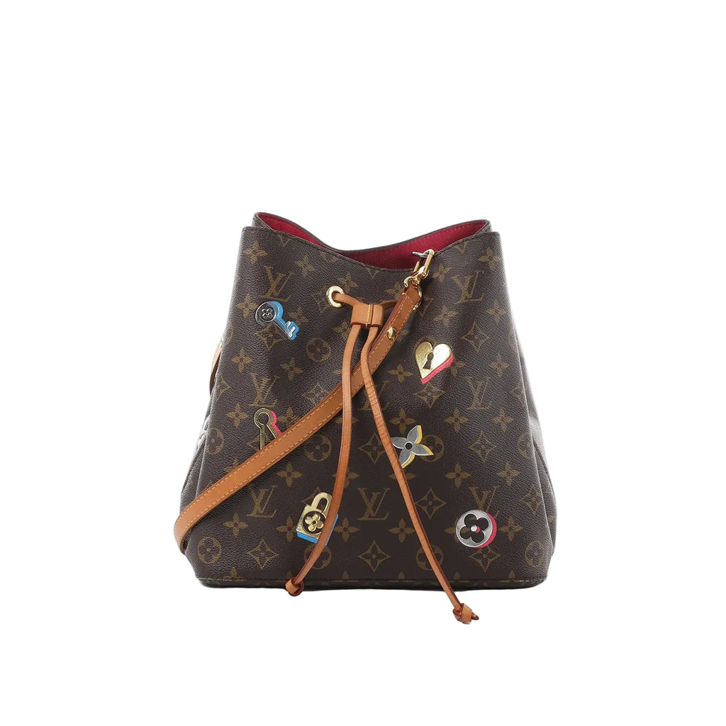 Louis Vuitton Néonoé bucket bag in brown Monogram canvas with colorful lock-and-key motifs, tan leather drawstring, and adjustable shoulder strap on a white background.