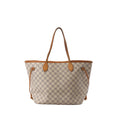 Louis Vuitton Neverfull MM Damier Azur checkerboard tote bag in beige and white with vachetta leather shoulder straps, trim, and side drawstring laces on white background.