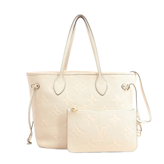 Louis Vuitton Neverfull MM M46676 shoulder bag in white Monogram Empreinte leather with embossed LV pattern, dual top handles, side drawstrings, and matching removable zip pouch.