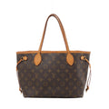 Louis Vuitton Neverfull PM bag in brown Monogram canvas with tan leather shoulder straps, trim and side ties, shown from the front.