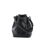 Louis Vuitton Noé bucket shoulder bag in black Epi textured leather with drawstring closure, adjustable shoulder strap, and black leather base, front view on white background