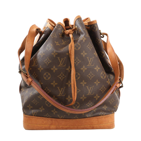 Louis Vuitton Noé Shoulder Bag M42224 in brown Monogram canvas with natural leather base, trim, adjustable shoulder strap, and drawstring top closure.