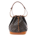 Louis Vuitton Noé brown Monogram canvas bucket bag with tan leather base, drawstring closure and adjustable shoulder strap.