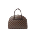 Louis Vuitton Nolita handbag in brown Damier Ebene checkerboard canvas with dome silhouette, double top handles, and zip-top closure.