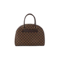 Brown checkered Louis Vuitton Damier Ebene Nolita handbag with dark brown leather top handles and gold-tone hardware on a white background.