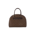Brown checkered Louis Vuitton Damier Ebene Nolita handbag with dark brown leather top handles and gold-tone hardware on a white background.
