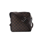 Louis Vuitton Olav PM crossbody bag in brown Damier Ebene canvas with leather trim, top zip closure and an adjustable logo strap.