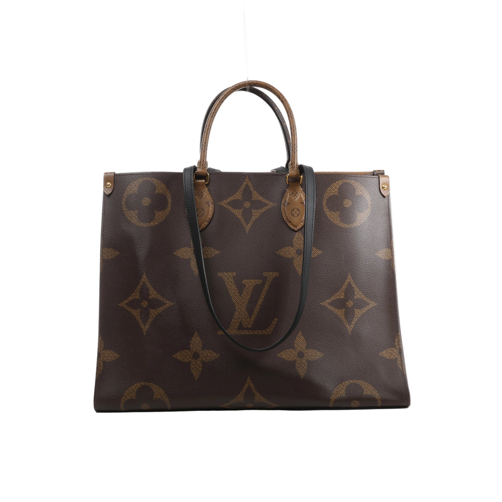 Front view of Louis Vuitton OntheGo GM brown Giant Monogram tote with contrasting Monogram Reverse top handles and long black shoulder straps.