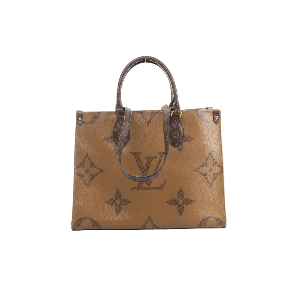 Front view of Louis Vuitton OntheGo MM in brown Giant Monogram Reverse with dark Monogram top handles, long shoulder straps and gold-tone hardware.