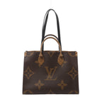 Front view of a brown Louis Vuitton OnTheGo tote with oversized Monogram motifs, rolled top handles, long black shoulder straps and gold-tone fittings.