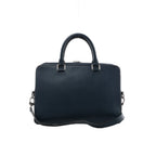 Front view of Louis Vuitton Porte-Documents Business MM in navy blue textured leather with rounded top handles, silver-tone hardware and a shoulder strap.
