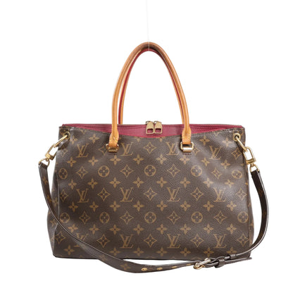 Louis Vuitton Pallas MM 2Way handbag featuring Monogram canvas with red leather trim, dual top handles, detachable shoulder strap, and gold-tone hardware.