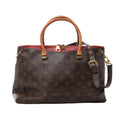 Brown Louis Vuitton Pallas Monogram canvas handbag with tan top handles, red leather trim, dark shoulder strap and gold-tone hardware.