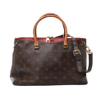 Brown Louis Vuitton Pallas Monogram canvas handbag with tan top handles, red leather trim, dark shoulder strap and gold-tone hardware.