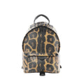 Louis Vuitton Palm Springs PM mini backpack in brown and black animal print with black top handle, double zip closure, and front zip pocket.