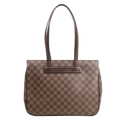 Louis Vuitton Parioli PM shoulder bag in brown Damier Ebene canvas with dark brown leather trim, featuring dual flat shoulder straps and a structured silhouette.
