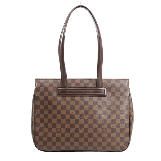 Louis Vuitton Parioli PM shoulder bag in brown Damier Ebene canvas with dark brown leather trim, featuring dual flat shoulder straps and a structured silhouette.