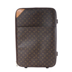 Louis Vuitton Pegas 60 brown Monogram canvas rolling suitcase with tan leather corner trim and black wheels, front view.