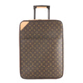 Louis Vuitton Monogram canvas rolling suitcase with telescopic handle, zip-around closure, and tan leather corner trim