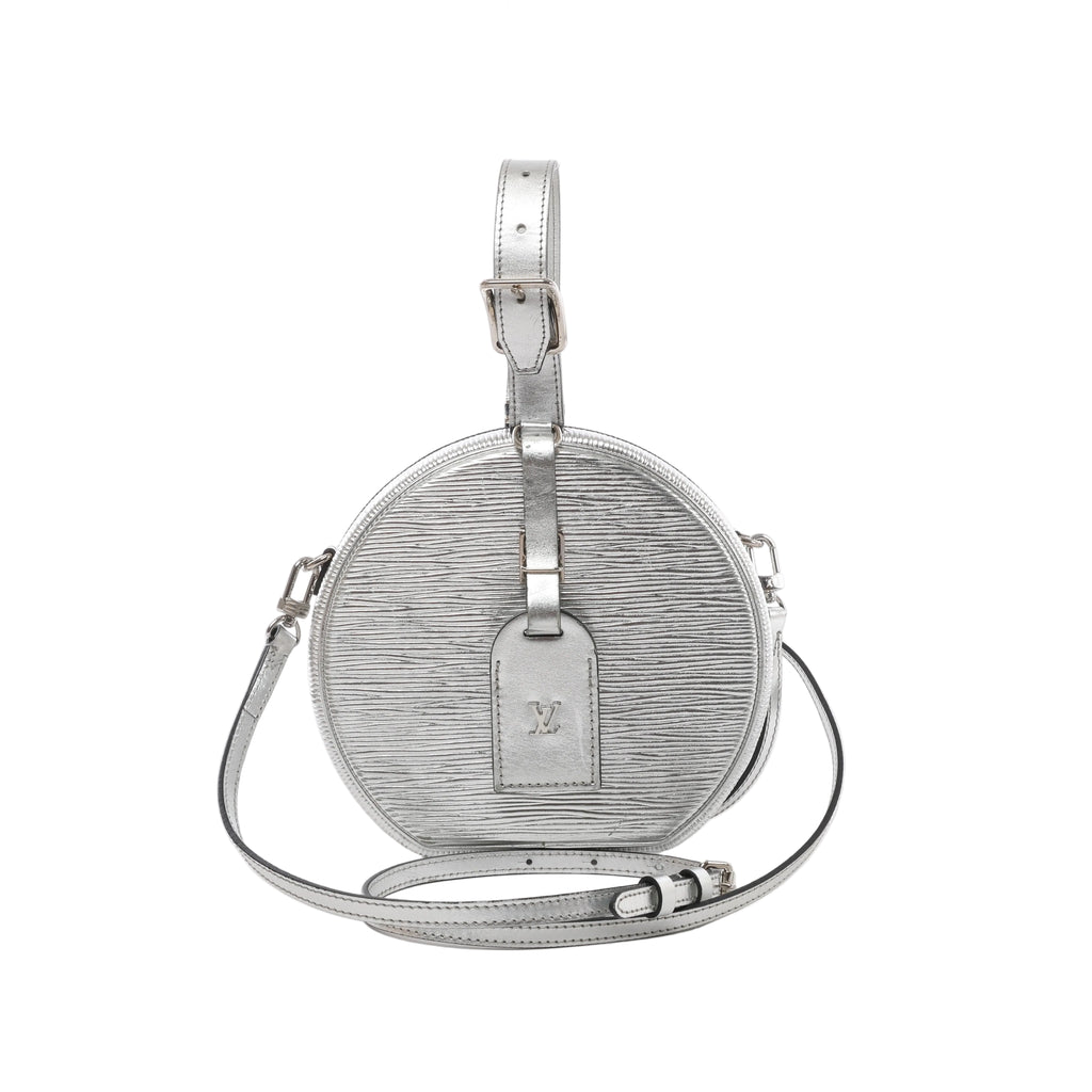 Front view of Louis Vuitton Petite Boîte Chapeau in silver Epi leather with buckled top handle, LV luggage tag and matching crossbody strap.