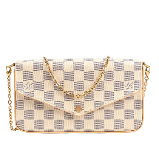 Front view of a Louis Vuitton Pochette Félicie crossbody bag in beige Damier Azur canvas, featuring an envelope-style flap, gold-tone button snap, and detachable gold chain strap.