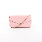 Pink Louis Vuitton vernis leather Pochette Félicie crossbody bag with envelope flap, gold-tone chain strap, and snap-button closure.