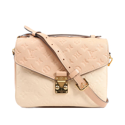 Louis Vuitton Pochette Métis MM crossbody bag M44300 in pink Monogram Empreinte leather, featuring a flap front with gold-tone S-lock closure, embossed monogram pattern, adjustable leather strap, and soft two-tone pink and cream color design.
