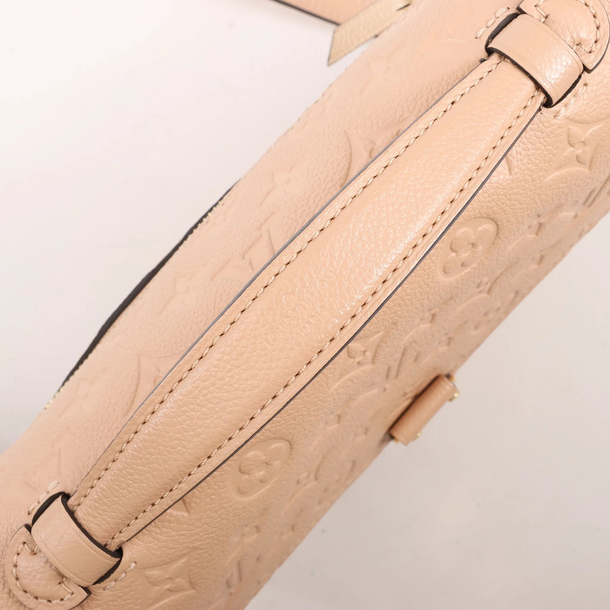 Louis Vuitton Pochette Metis MM Monogram Empreinte Crossbody Bag in Pink M44300