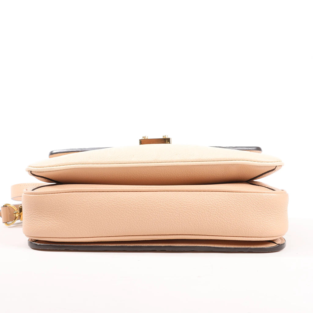 Louis Vuitton Pochette Metis MM Monogram Empreinte Crossbody Bag in Pink M44300