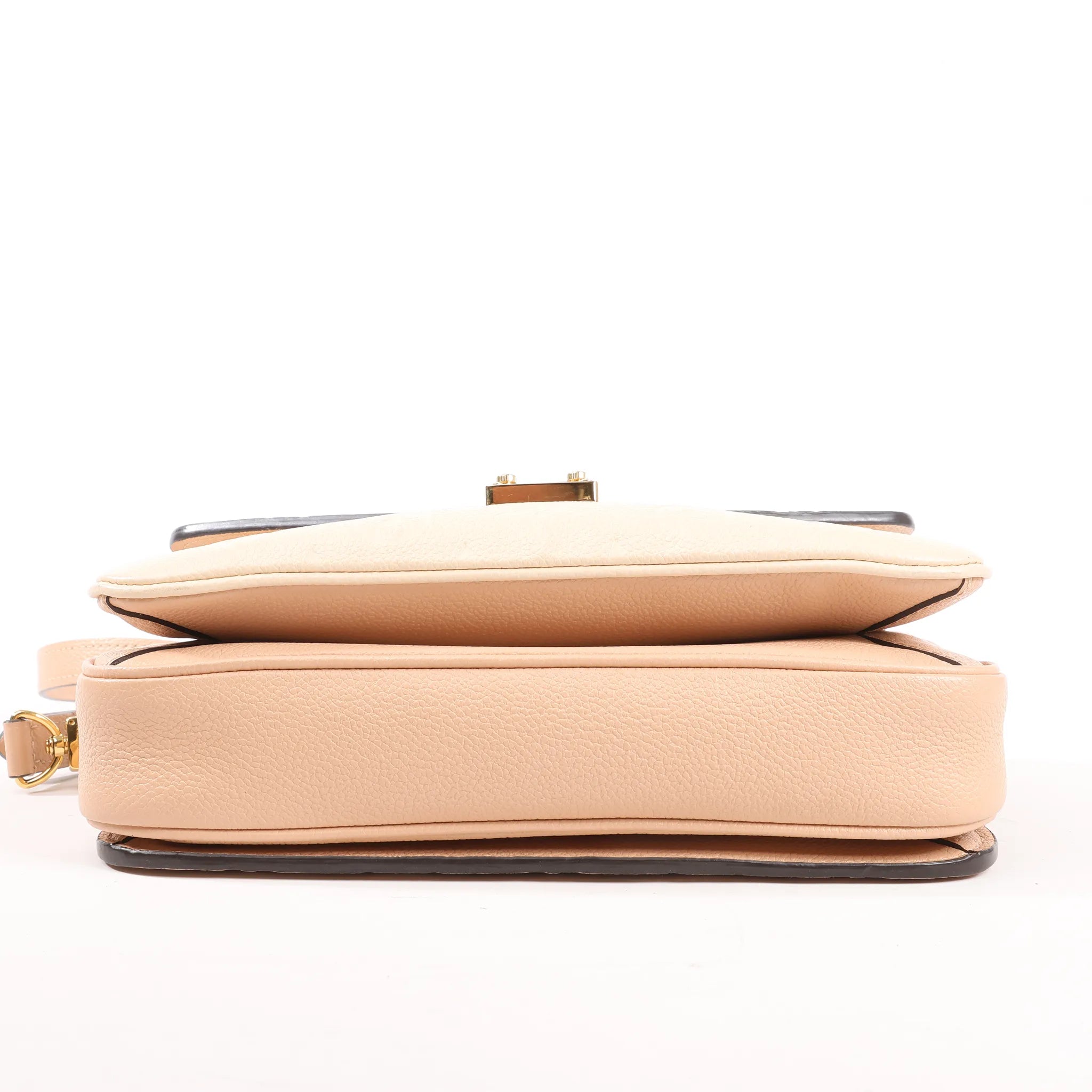 Louis Vuitton Pochette Metis MM Monogram Empreinte Crossbody Bag in Pink M44300