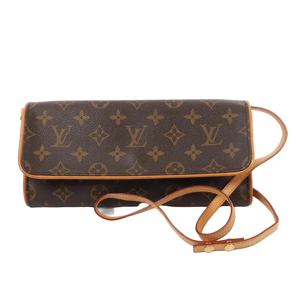 Front view of the Louis Vuitton Monogram Canvas Pochette Twin GM Shoulder Bag M51852, featuring classic brown monogram canvas, natural leather trim, a long adjustable shoulder strap, and flap closure, displayed against a white background.