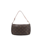 Louis Vuitton Pochette Accessoires in brown Monogram canvas with a slim tan leather strap, gold-tone hardware and top zip closure.